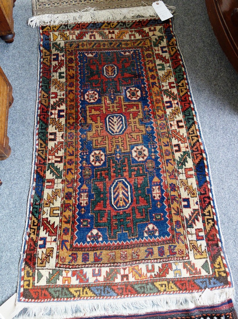 Appraisal: A Shirze rug worn leaf and wine glass border early