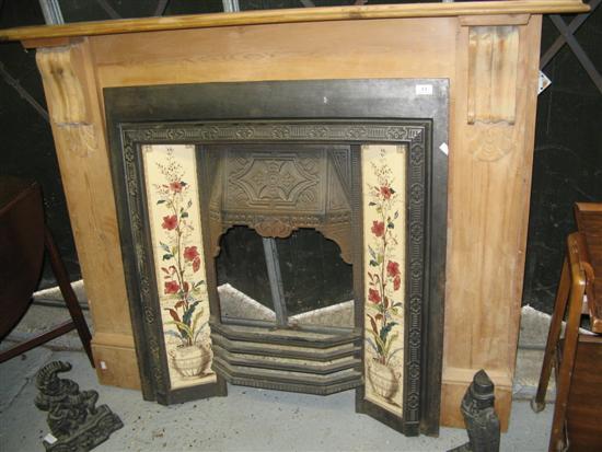 Appraisal: Cast iron fire surround with tile decoration and two figural