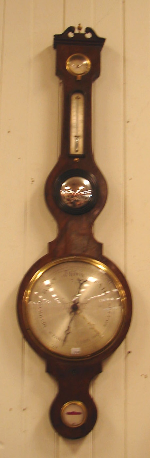 Appraisal: wooden case features barometer at upper portion weather in dial