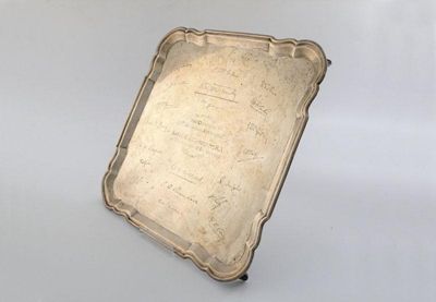 Appraisal: A presentation silver salver of shaped square form moulded border