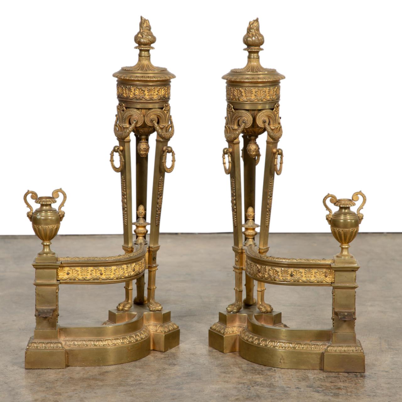 Appraisal: PR NEOCLASSICAL STYLE GILT BRONZE URN CHENETS Likely French pair