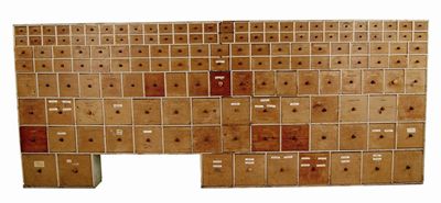 Appraisal: A large th century bank of pine drawers consisting of