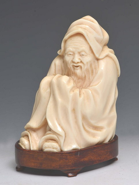 Appraisal: A CHINESE IVORY CARVING carved in the form of a