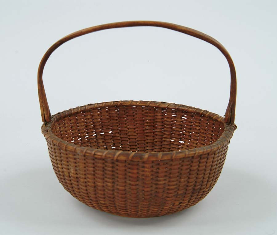 Appraisal: ANTIQUE WOODEN HANDLE NANTUCKET BASKET Round basket has round wood