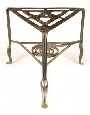 Appraisal: A th century steel triangular trivet the pierced top with