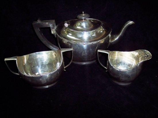 Appraisal: A three-piece tea service of oval shape with decorative borders