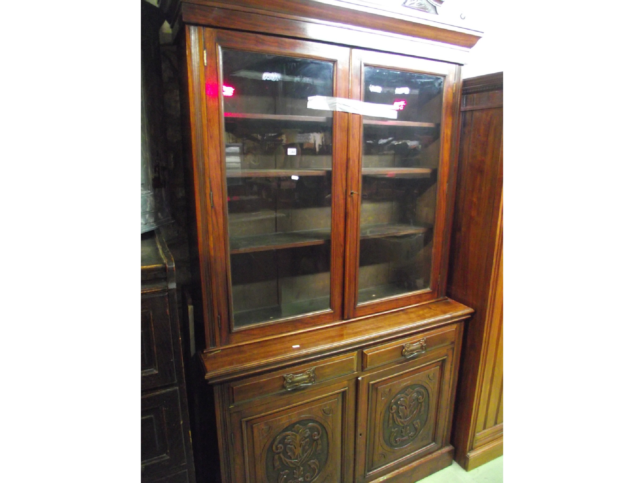 Appraisal: A late Victorian walnut library bookcase the upper recessed section