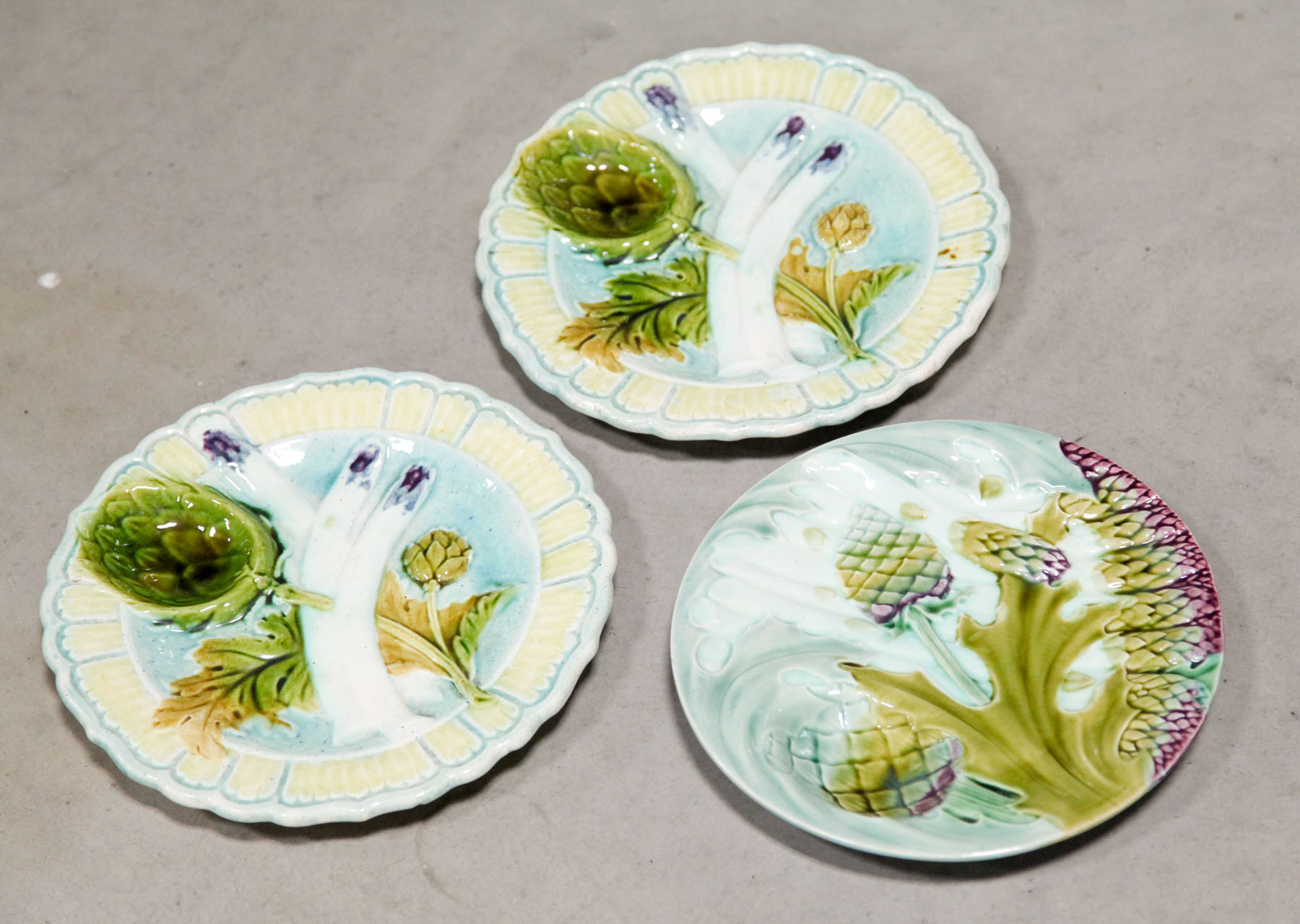 Appraisal: THREE MAJOLICA PLATES French and English late th early th