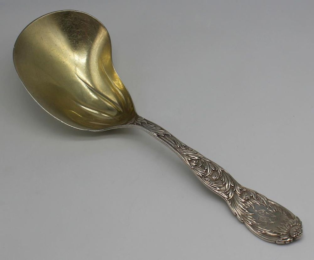 Appraisal: STERLING Tiffany Co Chrysanthemum Berry Spoon Tiffany Co monogrammed Chrysanthemum