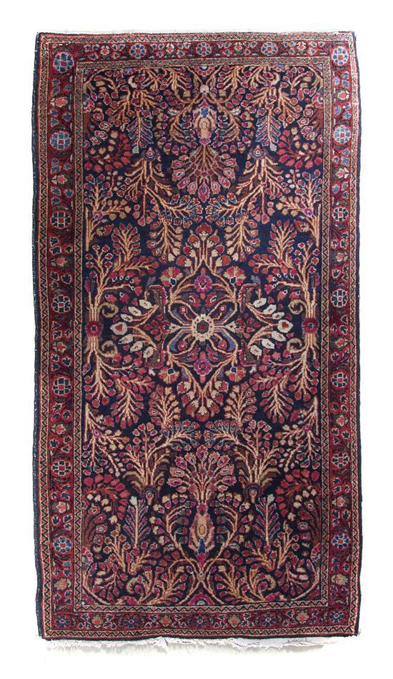 Appraisal: A Persian Wool Rug with red and yellow accents feet