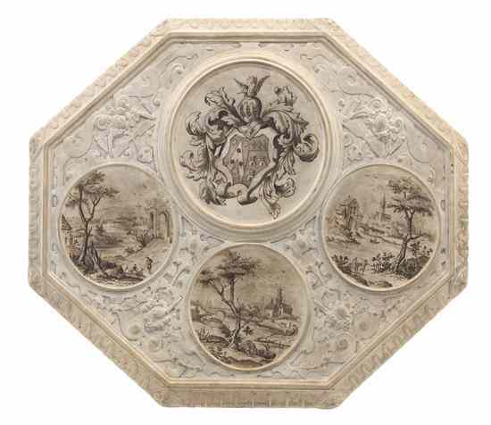 Appraisal: A Continental Ceramic Trivet of elongated octagonal form decorated with