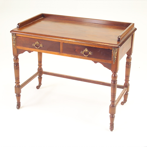 Appraisal: English mahogany writing table with gallery top two drawers and