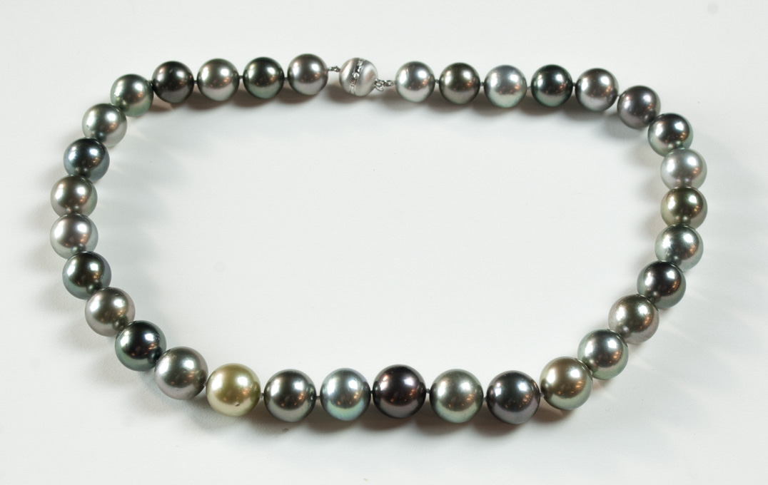 Appraisal: MULTI-COLOR BLACK PEARL NECKLACE measuring - inches in length and