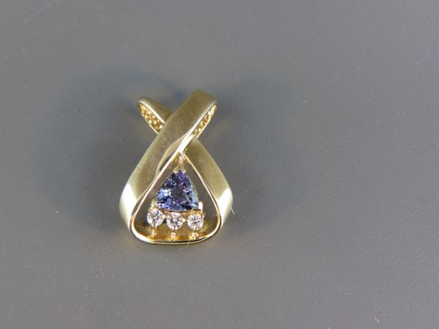 Appraisal: Tanzanite Diamond Pendant triangular gem weighing carat with diamonds totaling