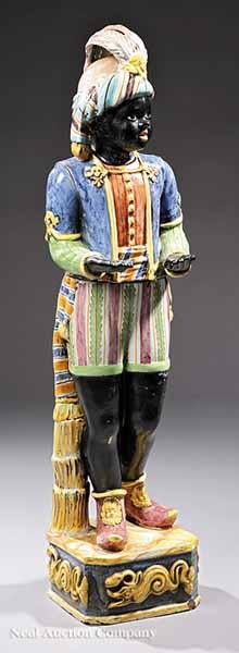 Appraisal: An Italian Glazed Terracotta Figure of a Blackamoor in two