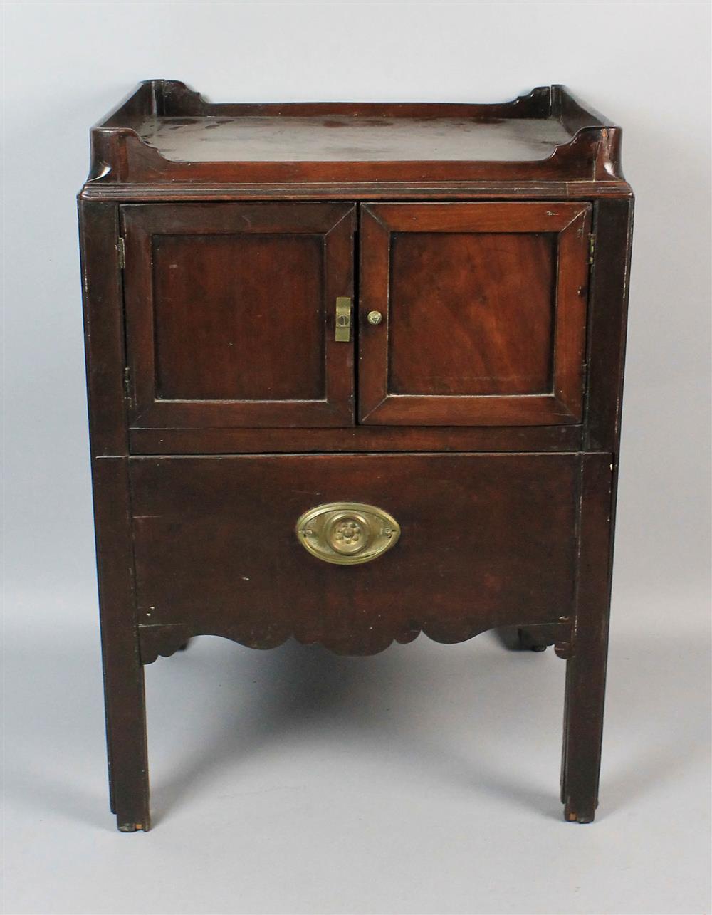 Appraisal: TH C MAHOGANY BEDSIDE TABLE having a rectangular top with