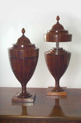 Appraisal: A pair of early th century mahogany cutlery urns with