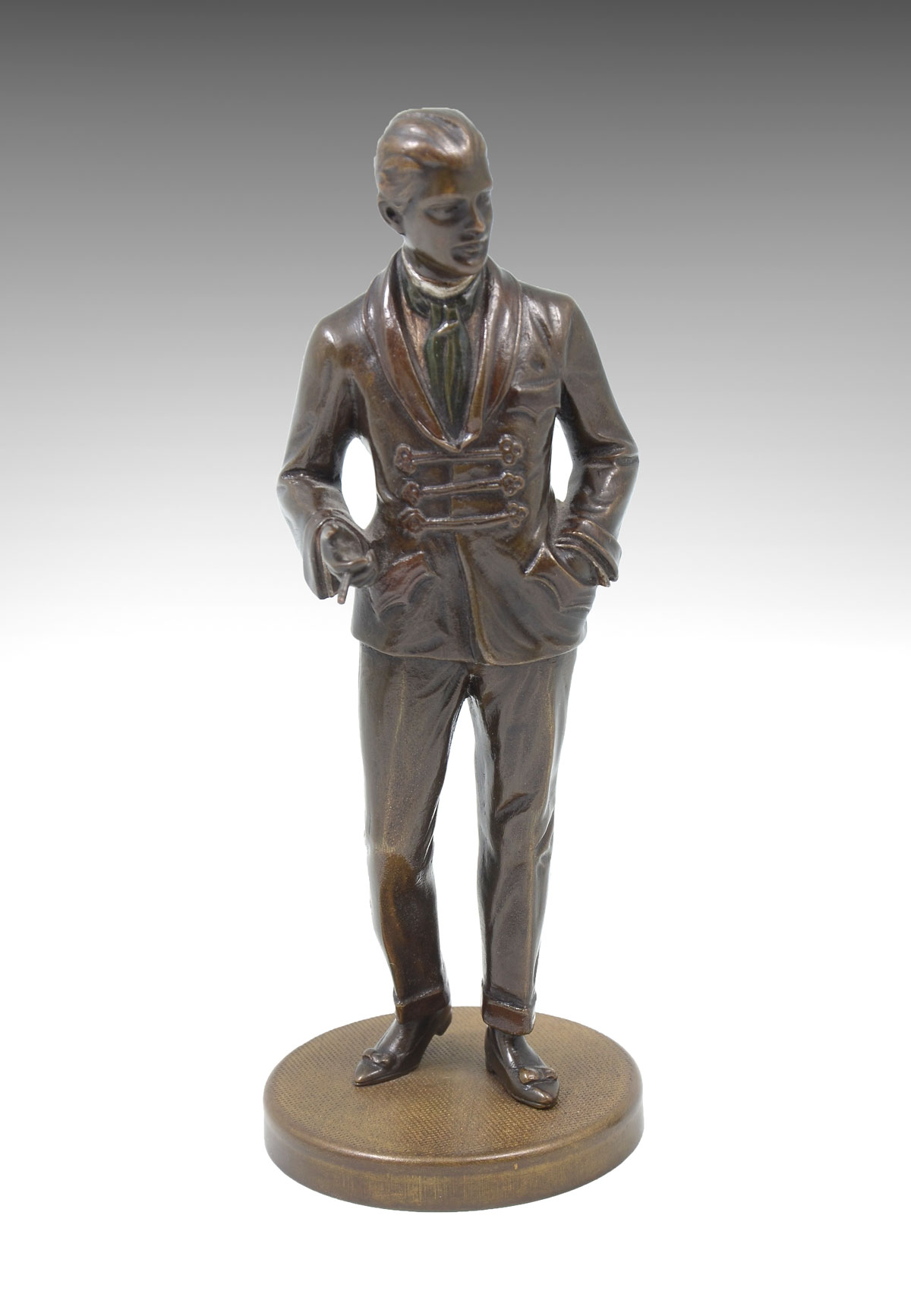 Appraisal: PATINATED BRONZE SCULPTURE OF A WELL DRESSED STANDING YOUNG MAN