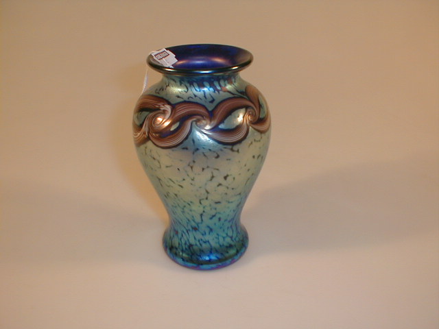 Appraisal: A blue lustre glass vase with swirled brown and white