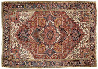 Appraisal: Heriz rug central medallion on brick red field ivory corner