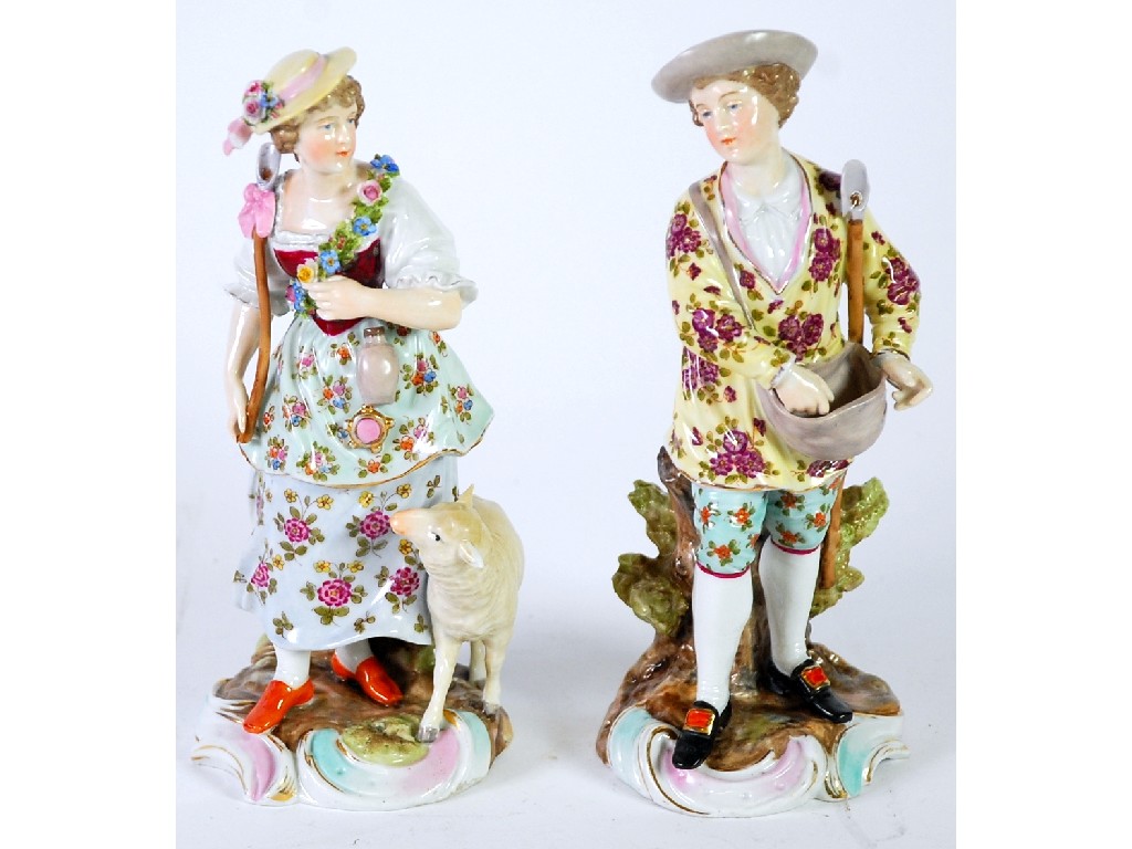 Appraisal: PAIR OF SITZENDORF PORCELAIN FIGURES polychrome painted and modelled as