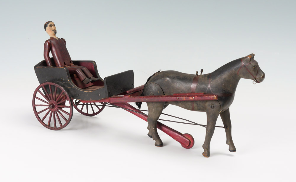 Appraisal: CARVED FOLK ART TROTTER CARRIAGE Trotter horse with articulated legs