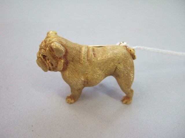 Appraisal: A gold and ruby set brooch designed as a bulldog