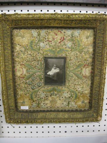 Appraisal: th Century Crewell Embroidery Frame photo of an infant elaborate