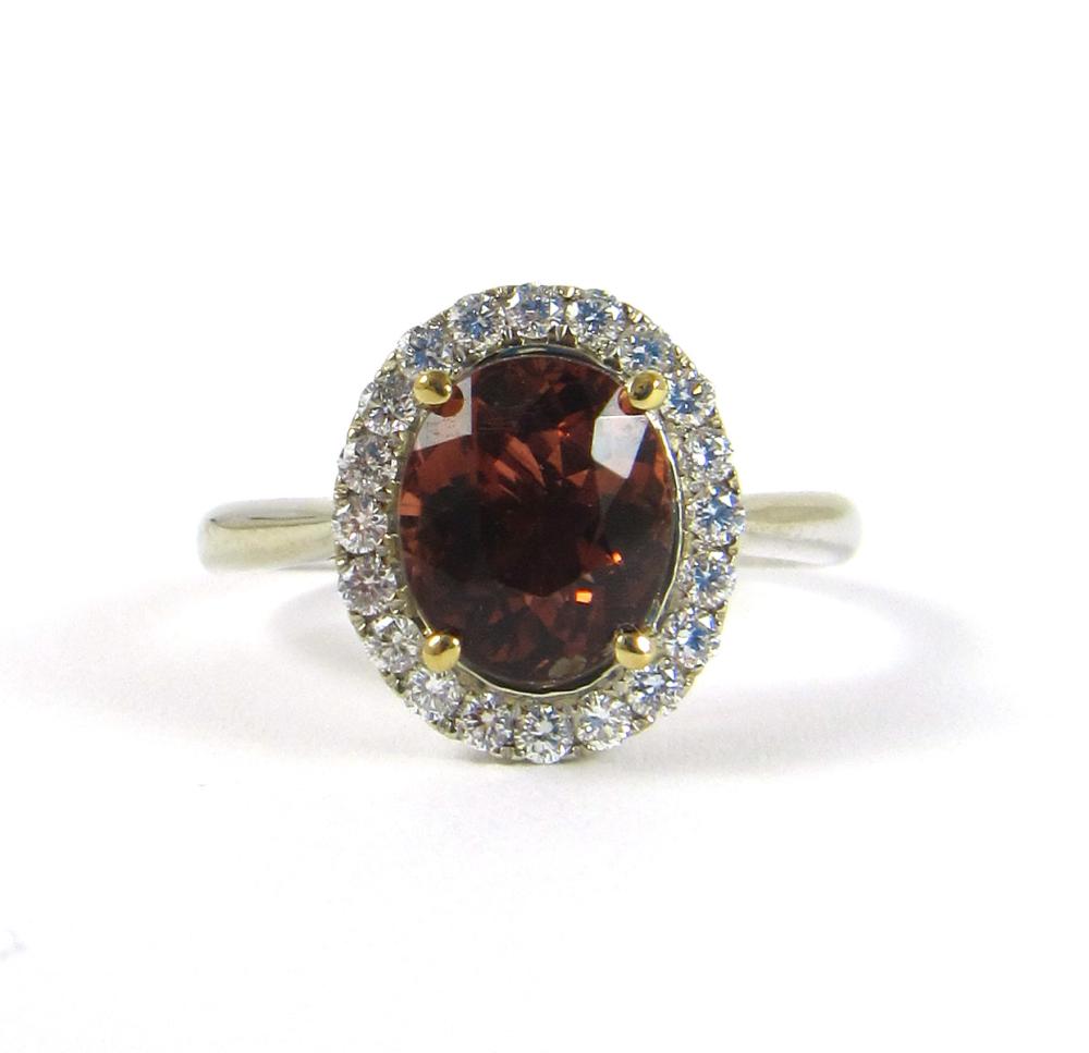 Appraisal: ORANGE TOURMALINE DIAMOND AND FOURTEEN KARAT GOLD RING The k