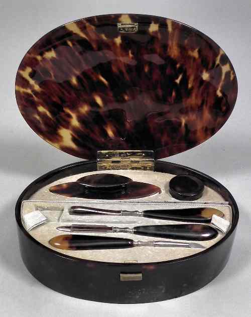 Appraisal: A George V tortoise-shell oval boxed manicure set with silver