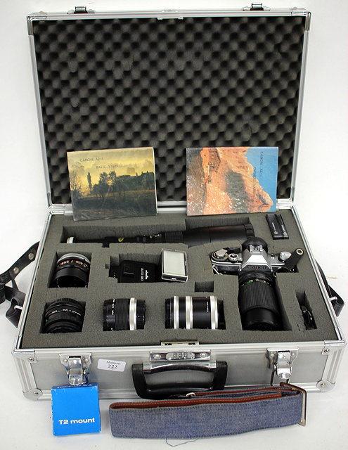 Appraisal: A CANON AE MM CAMERA OUTFIT to include various lenses