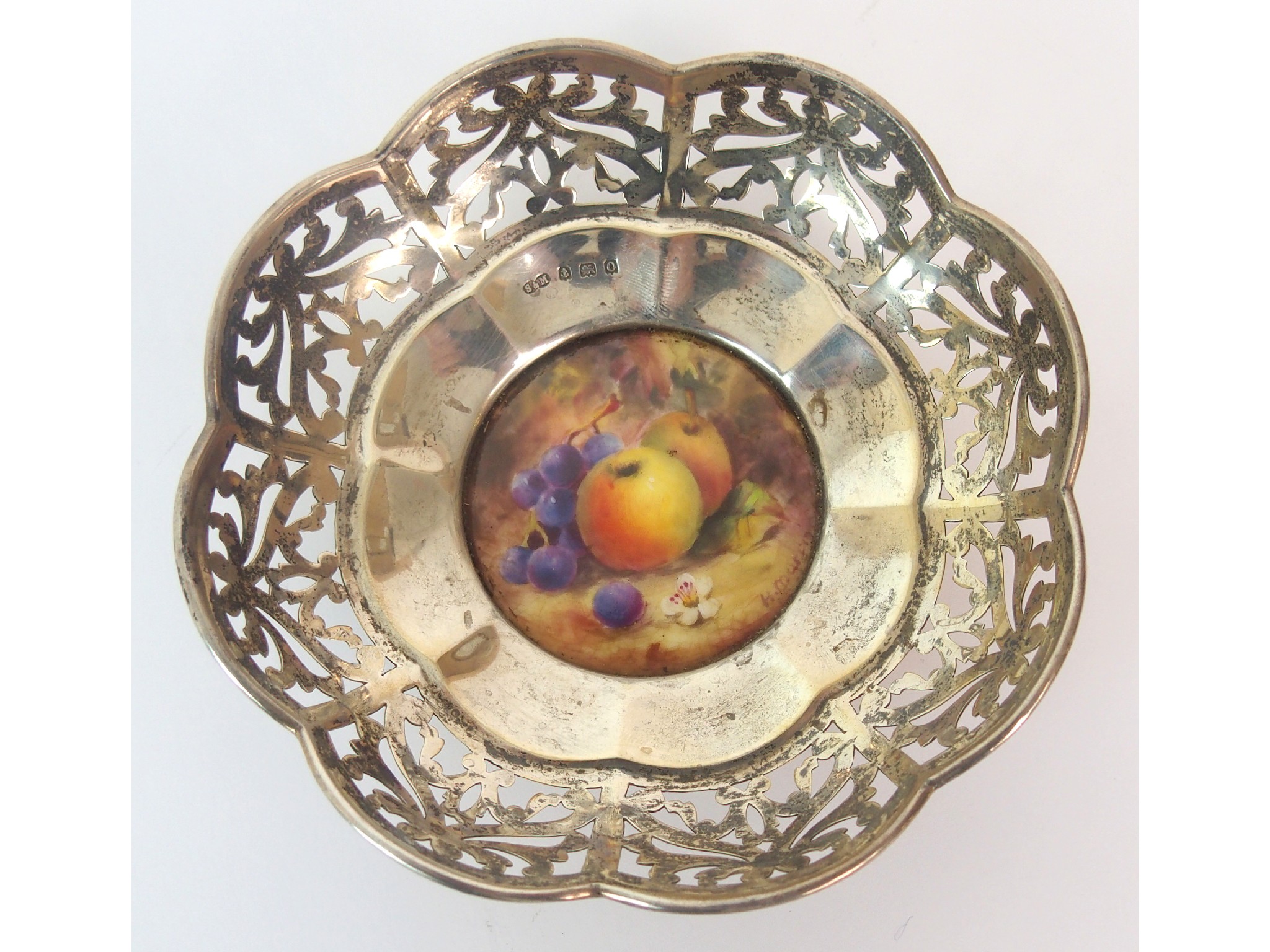 Appraisal: A Royal Worcester painted miniature fruit plate with silver mountpainted