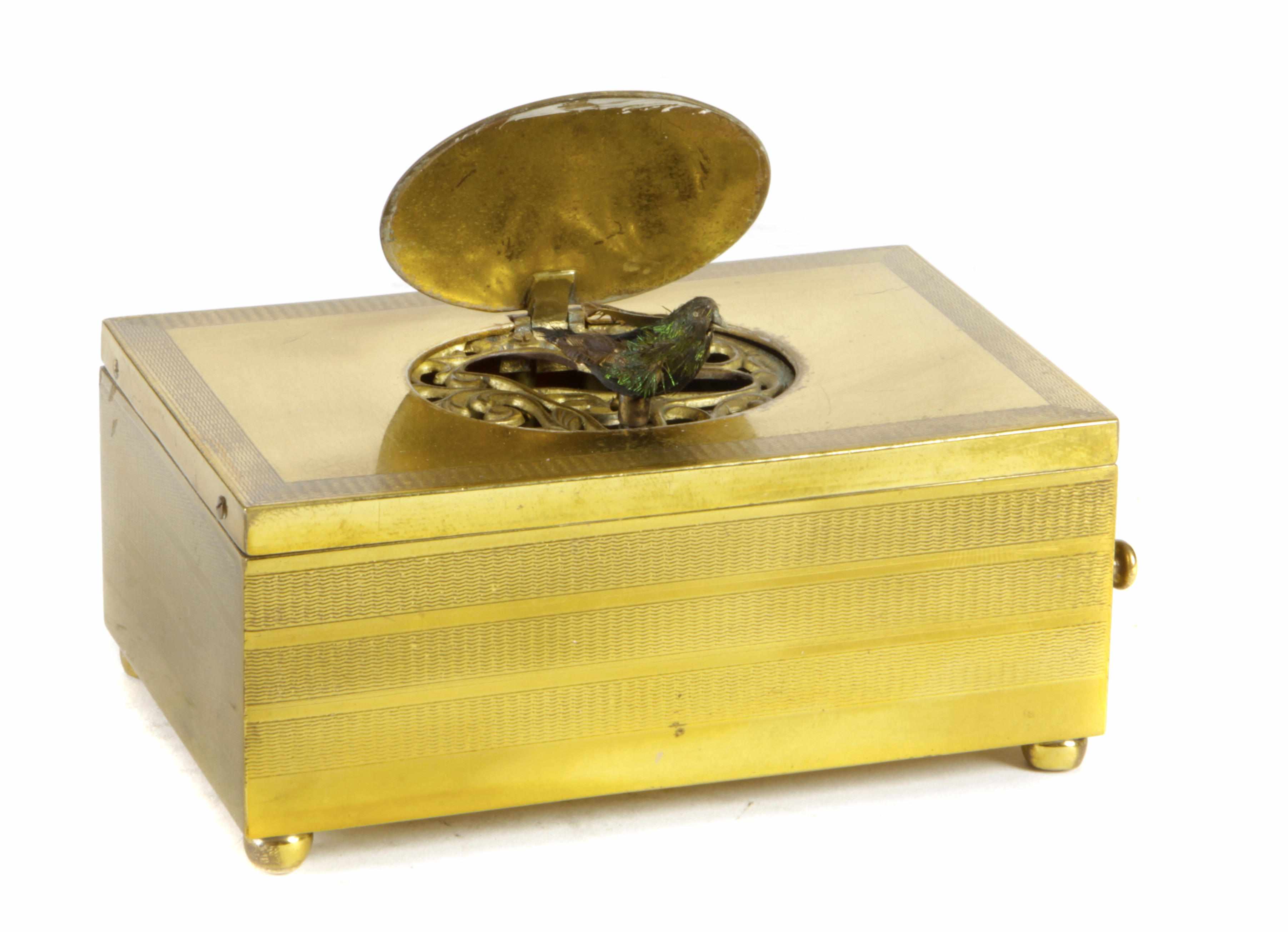 Appraisal: A Continental gilt metal singing bird music box height in