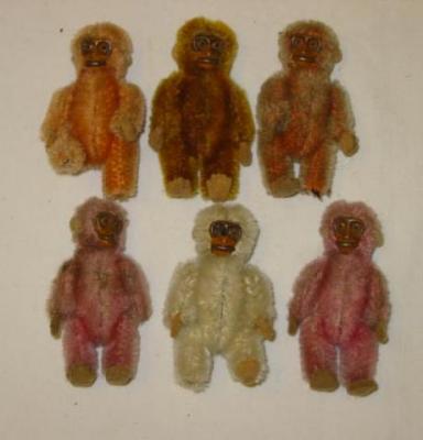 Appraisal: A set of six miniature monkeys with painted tin plate