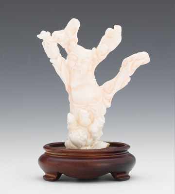 Appraisal: A Carved Angelskin Coral Figurine Carved and polished figure of