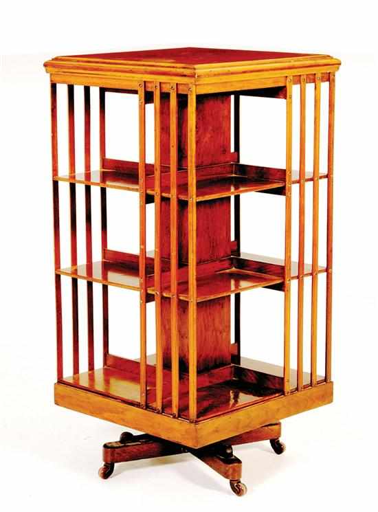 Appraisal: Mahogany revolving bookcase square molded top above three tiers of