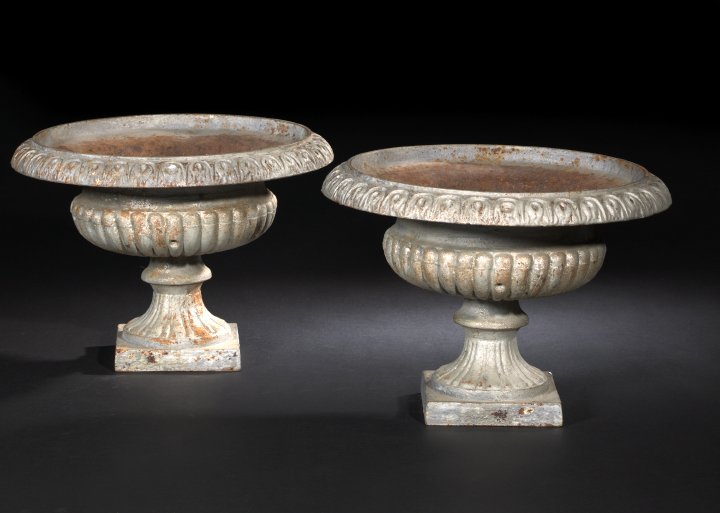 Appraisal: Pair of English Cast-Iron Garden Urns of Footed Basin Form