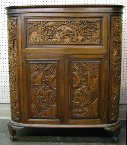 Appraisal: Carved Oriental bar cabinet with multiple storage doors bottle and