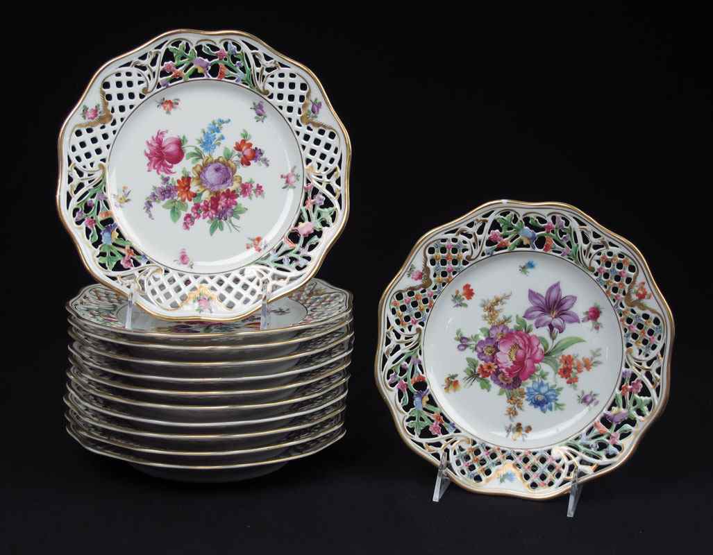 Appraisal: SET OF SCHUMANN DRESDEN RETICULATED PLATES Reticulated borders centering floral