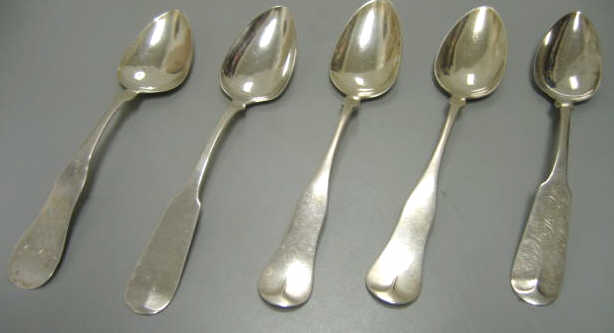 Appraisal: FIVE ANTIQUE AMERICAN SILVER SPOONS Coin and sterling silver dessert