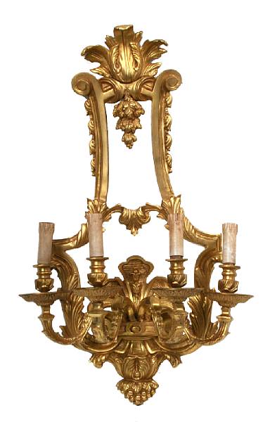 Appraisal: A pair of Regence style four light gilt bronze sconces