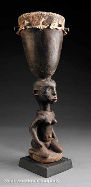 Appraisal: A Makonde Figural Drum Tanzania the kneeling female with finely