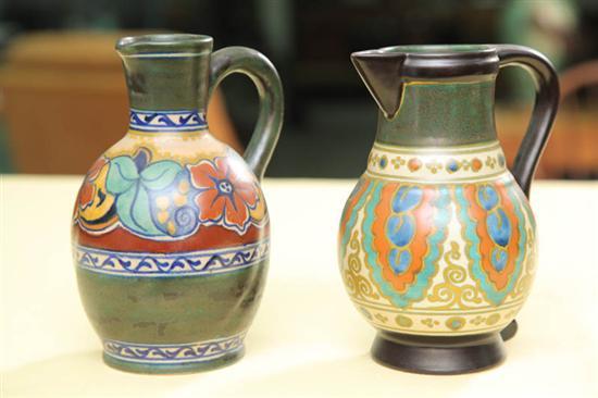 Appraisal: TWO GOUDA POTTERY PITCHERS Circa and Floral decorated with three