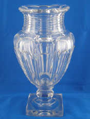 Appraisal: A glass urn shaped vase on square base by Musee