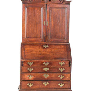 Appraisal: A Chippendale Carved and Paneled Mahogany Slant-Front Desk-and-Bookcase Manner of