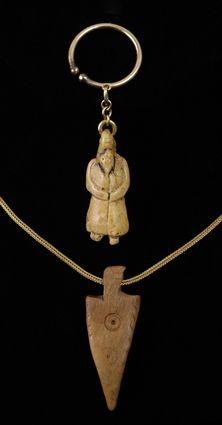 Appraisal: Carved Bone Figure together with an Bone Arrow Head Pendant