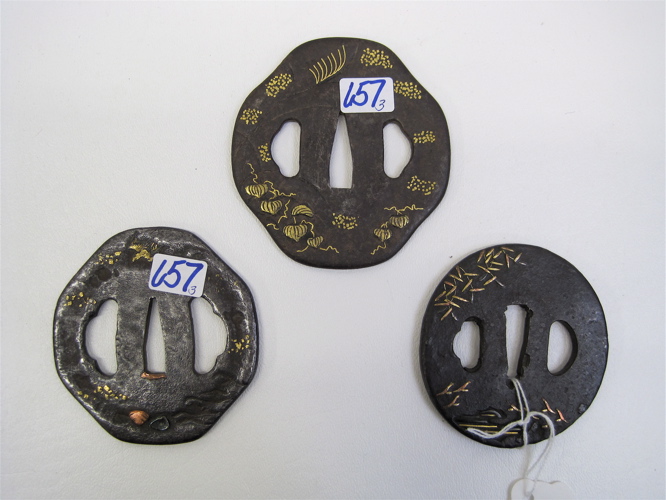 Appraisal: THREE JAPANESE TSUBA Meiji Period in patinated iron inlaid with