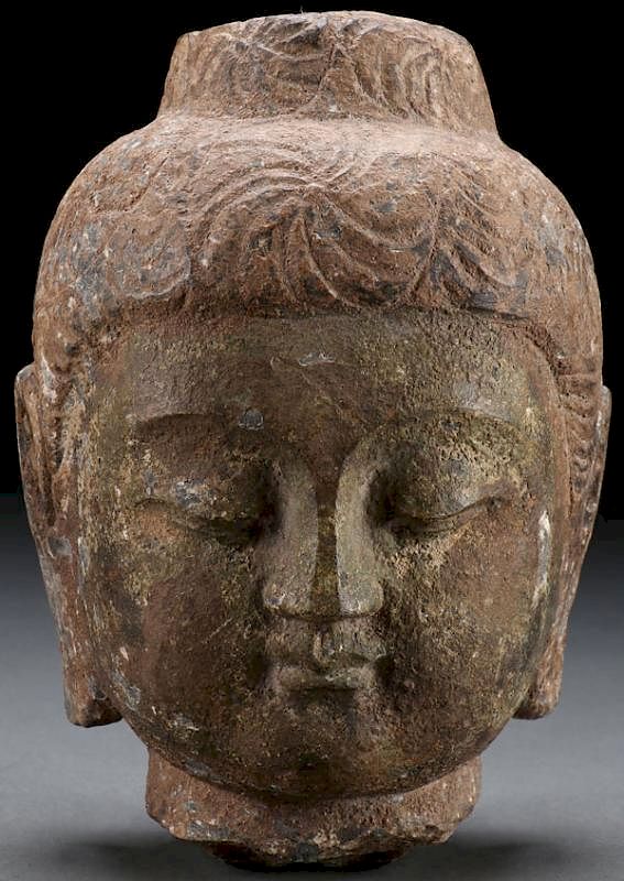 Appraisal: A CARVED STONE BUST OF A BUDDHA PROBABLY TH C