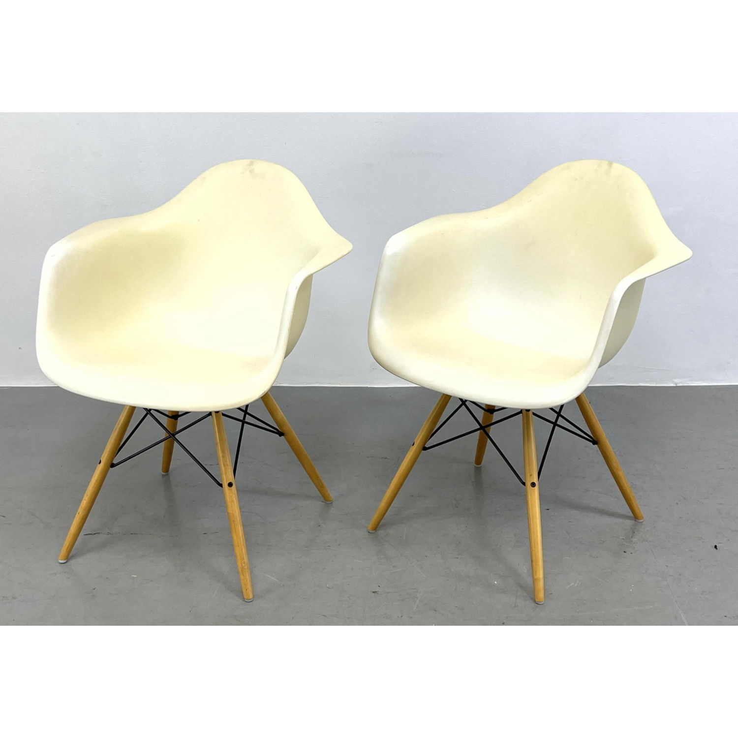 Appraisal: Pr Vitra Eames office shell arm chairs Tan Labeled Dowell