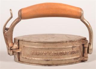 Appraisal: Antique Revolving Combination Iron By Family Laundry Iron Patented Feb